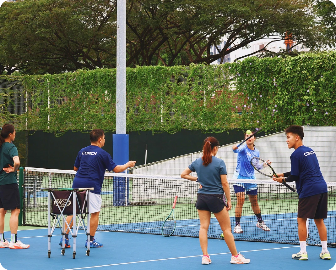 Certified tennis coach conducting one-on-one tennis training